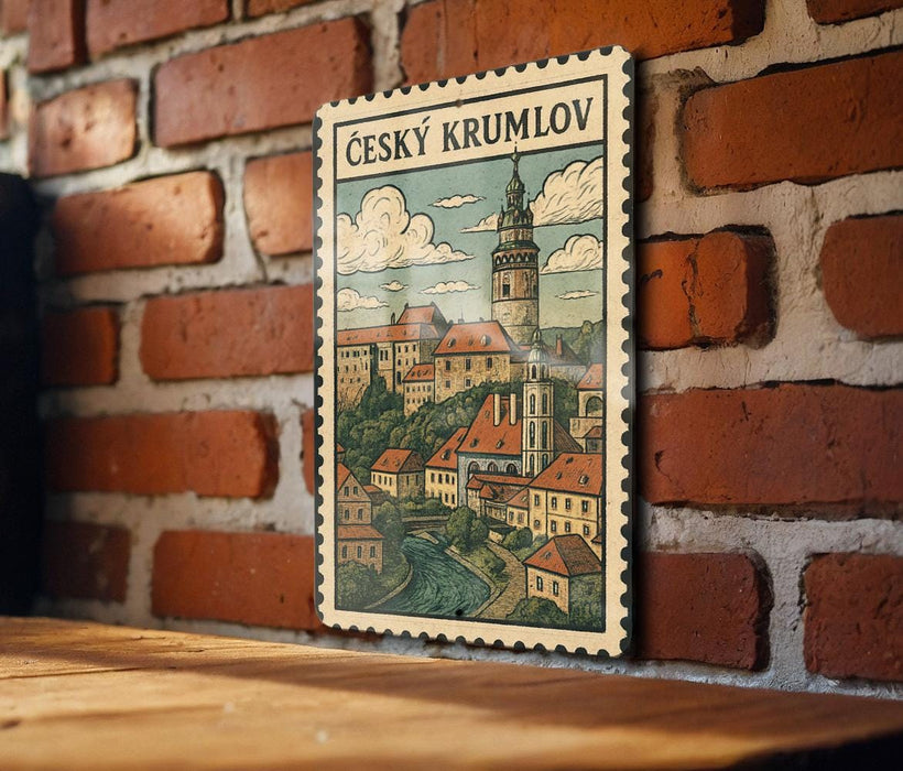 A vintage postage stamp depicting a castle and village in Czech Republic, hanging on a brick wall.