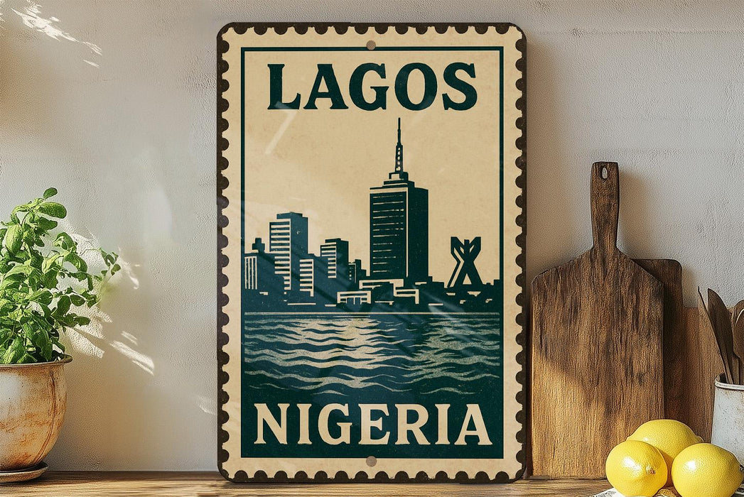 A vintage-style metal sign with the text "LAGOS NIGERIA" displayed prominently, featuring a cityscape illustration. The sign is placed on a shelf next to a wooden cutting board and a potted plant.