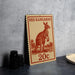 A red kangaroo stamp with the text "RED KANGAROO" and "20c" printed on it, placed on a gray surface next to some black camera lenses.