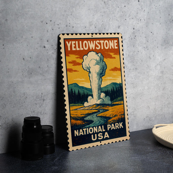 A vintage-style stamp depicting a scenic landscape with a steam explosion, representing Yellowstone National Park in the United States.