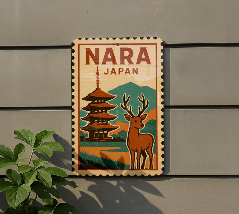 A vintage-style sign with the word "NARA" and "JAPAN" printed on it, featuring a pagoda and a deer in the background.