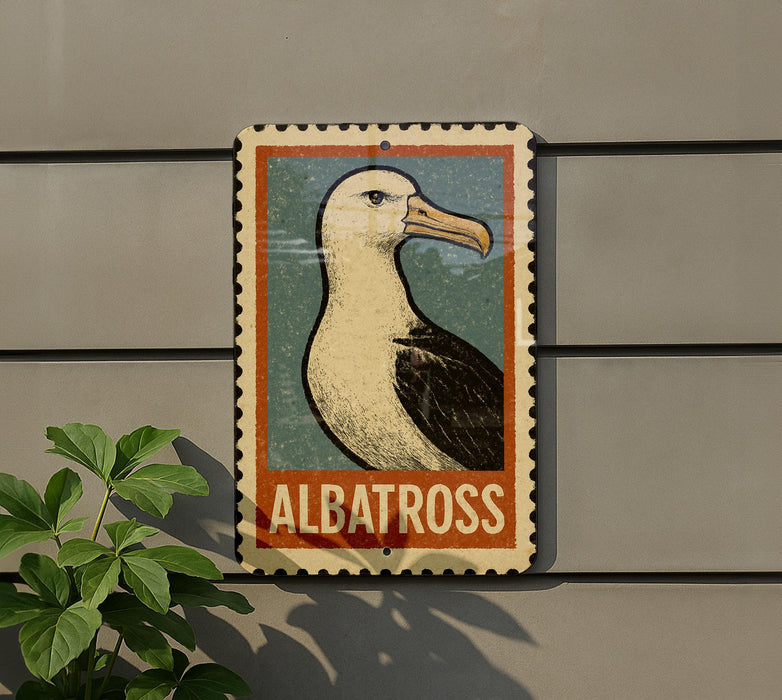 a sign with a picture of a seagull, mounted on a wall.