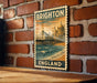 A vintage-style stamp depicting a coastal scene in Brighton, England, with a pier and buildings in the background.