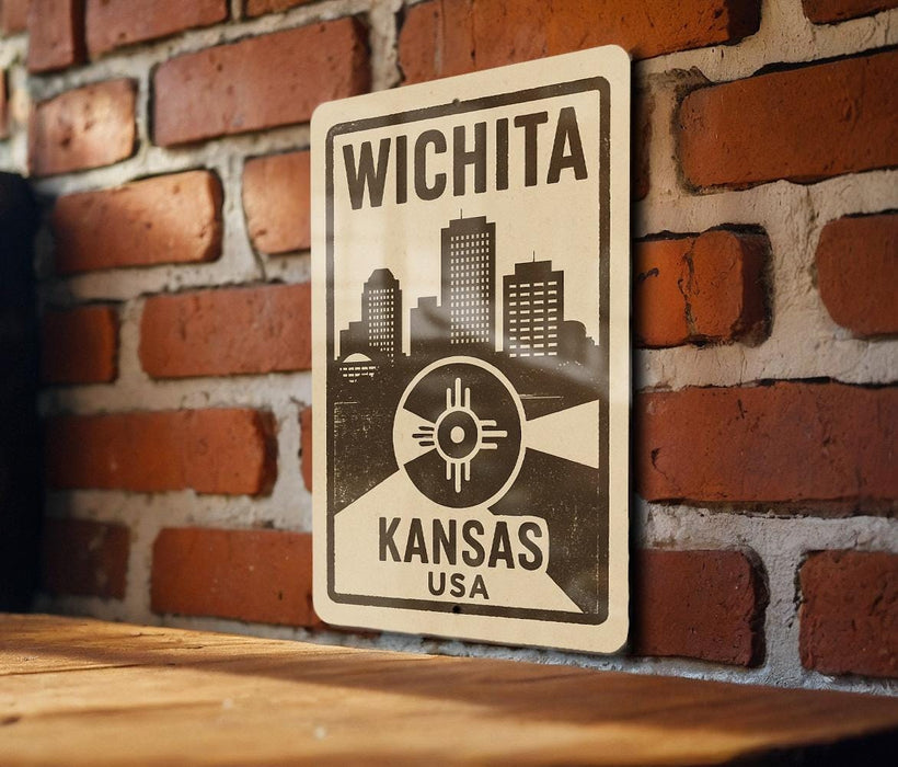 A metal sign displaying the name "WICHITA" and the location "KANSAS USA" is mounted on a brick wall.