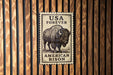 a sign with the text "USA FOREVER AMERICAN BISON" and an illustration of a bison.