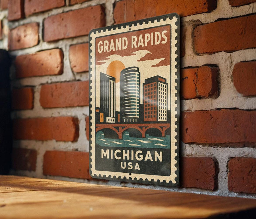 A vintage-style metal sign with the text "GRAND RAPIDS MICHIGAN USA" displayed on a brick wall.