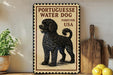 a vintage-style sign with a black and white illustration of a poodle, accompanied by text that reads "Portuguese Water Dog Forever USA".