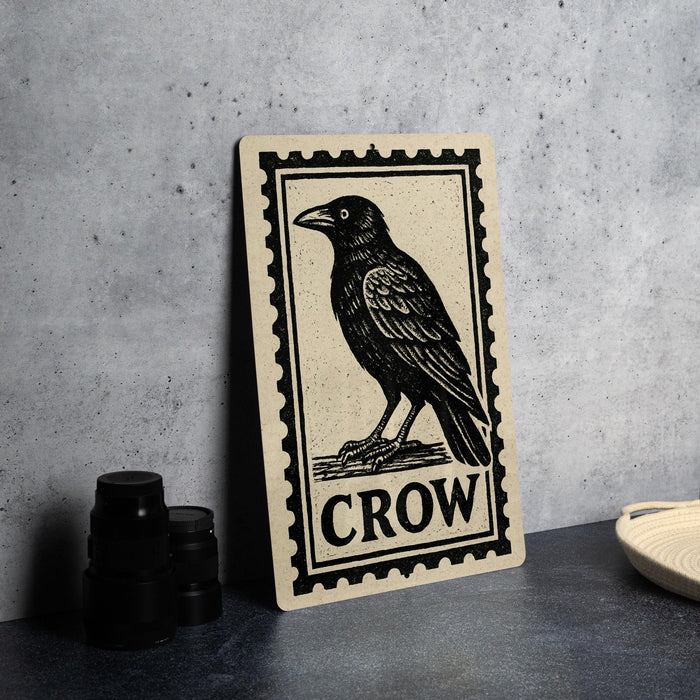 a black and white illustration of a crow perched on a branch, with the word "Crow" prominently displayed below the image.