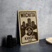 A sign for Wichita, Kansas USA, featuring a city skyline silhouette and the text "WICHITA KANSAS USA" on it.
