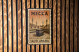 A vintage-style metal stamp depicting the Kaaba, the most sacred site in Islam, in the center of the Kaaba in the Kaaba Mosque in Mecca, Saudi Arabia.