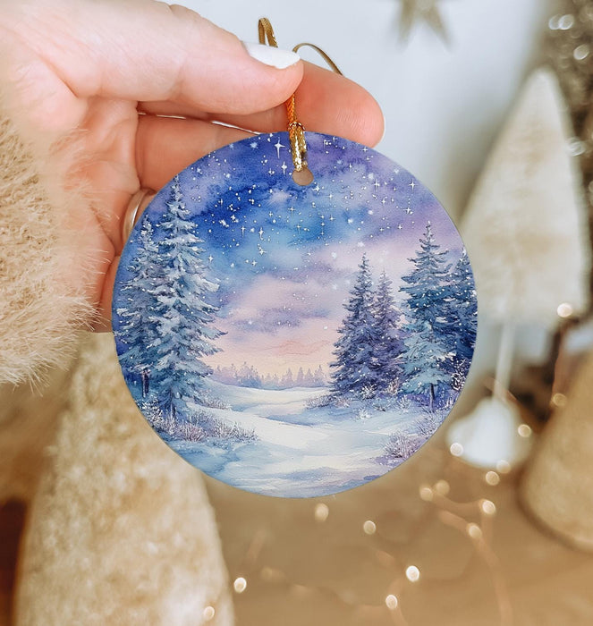 a person holding a christmas ornament in their hand