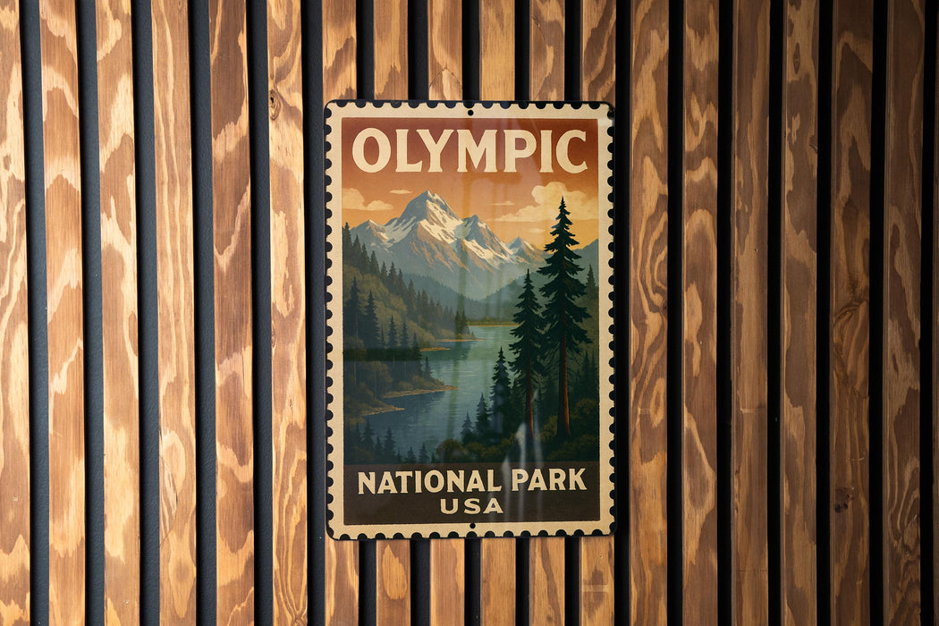 A vintage postage stamp featuring a scenic landscape with mountains, pine trees, and a lake, hanging on a wooden wall.