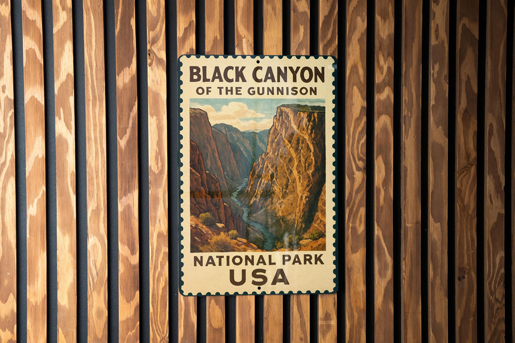 A vintage-style metal sign for the Black Canyon of the Gunnison National Park in the United States, featuring a scenic image of the canyon.