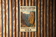 A vintage-style metal sign for the Black Canyon of the Gunnison National Park in the United States, featuring a scenic image of the canyon.