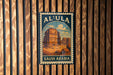 a vintage-style poster of the ancient city of Al-Ula in Saudi Arabia, with a wooden background.
