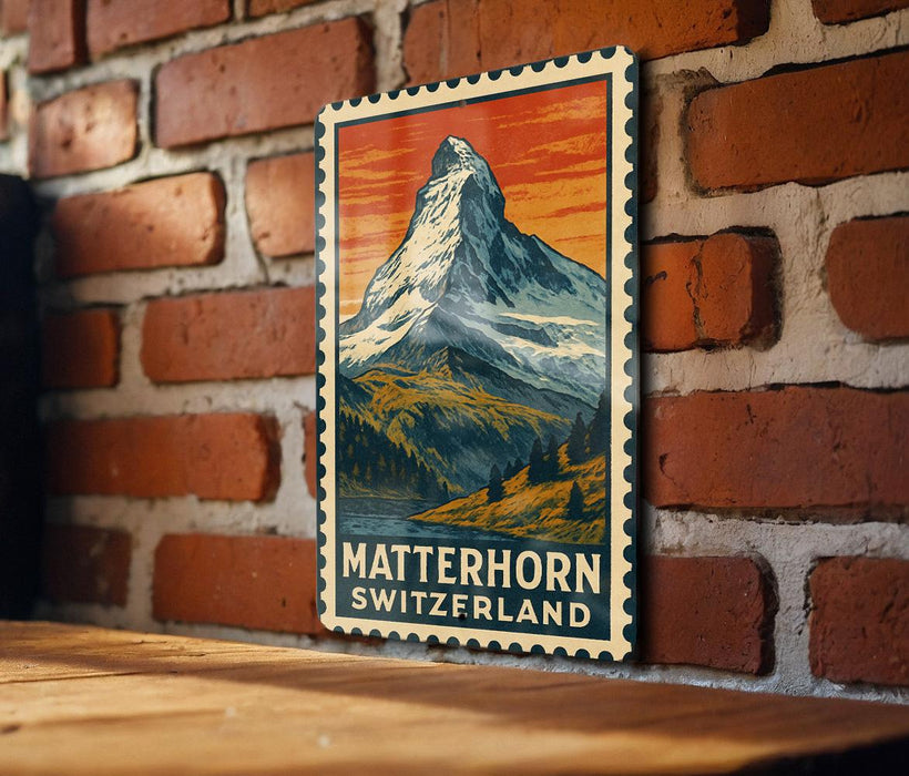 A vintage-style poster of the Matterhorn mountain in Switzerland, featuring a colorful illustration of the snow-capped peak against a mountainous landscape.