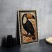 a wooden frame with a detailed illustration of a toucan perched on a branch, surrounded by orange leaves.
