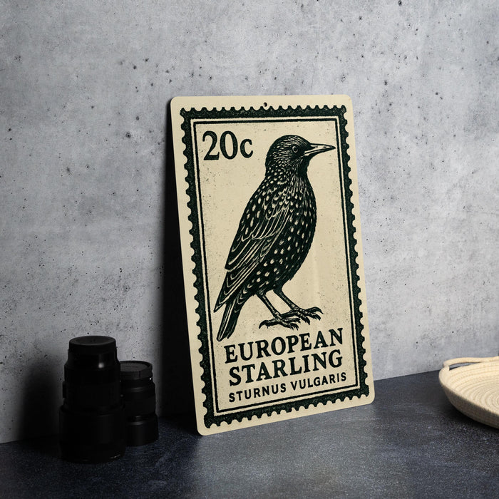 A metal stamp featuring a black and white illustration of a bird, with text indicating it is a European starling.