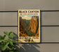 a vintage-style metal sign that reads "Black Canyon of the Gunnison National Park USA" with a mountain landscape in the background.