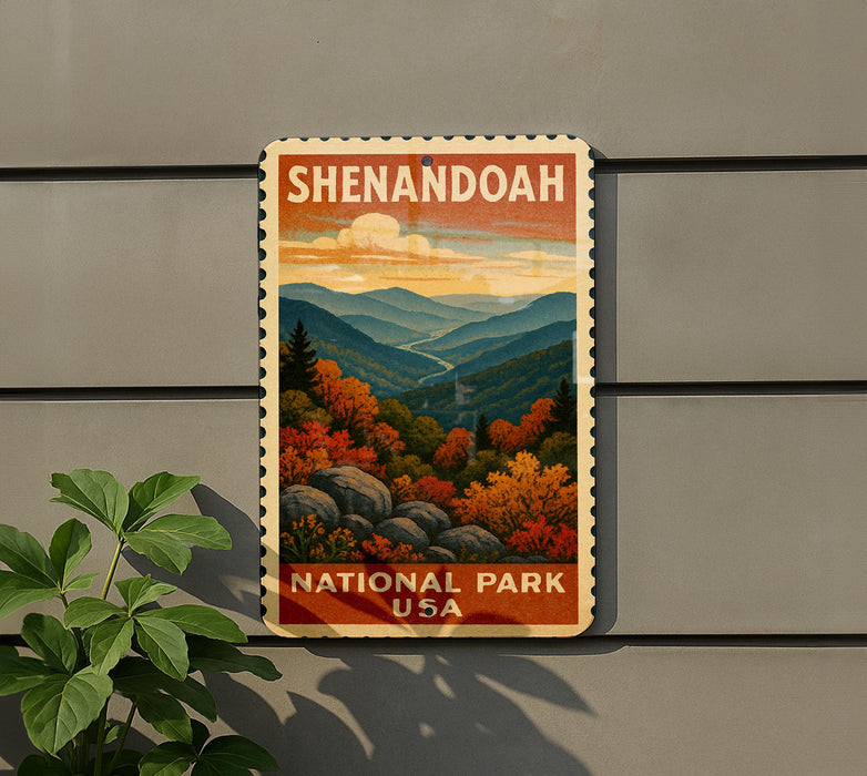 A vintage-style postage stamp depicting a scenic landscape with mountains, trees, and a winding road, hanging on a wall.