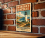 A vintage-style stamp or sign depicting a lighthouse and a coastal landscape, mounted on a brick wall.
