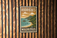 A vintage-style poster of Mauritius, a country in the Indian Ocean, is displayed on a wooden wall.