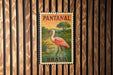 A vintage postage stamp from Pantanal, Brazil, featuring a pink flamingo standing in a pond surrounded by lush vegetation.