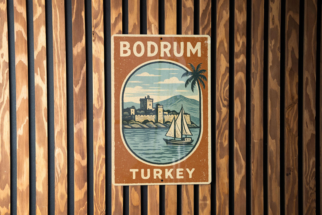 A vintage-style sign for Bodrum, Turkey, featuring a sailboat and a castle in the background.