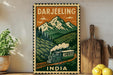 A vintage-style poster of a train traveling through a mountainous landscape, with the text "DARJEELING INDIA" prominently displayed.