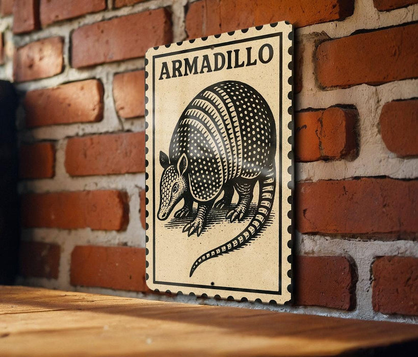 A sign featuring an illustration of an armadillo is mounted on a brick wall.