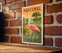 A vintage postage stamp featuring a pink flamingo in a lush green landscape, with the text "PANTANAL BRASIL" prominently displayed.