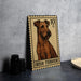 a metal stamp with an illustration of an Irish Terrier dog, placed on a table next to some black camera lenses.