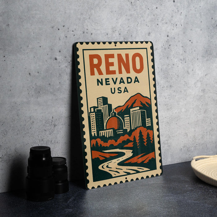 A metal sign with the text "Reno, Nevada, USA" and an illustration of the cityscape of Reno, Nevada, is displayed on a table.
