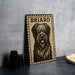 A metal sign with a black and white illustration of a dog's face, labeled "BRIARD", is displayed on a gray countertop next to some black camera lenses.