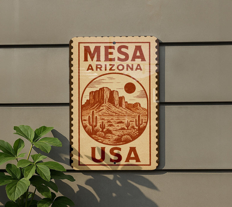 A sign for Mesquite, Arizona, USA, featuring a desert landscape with mountains and cacti.