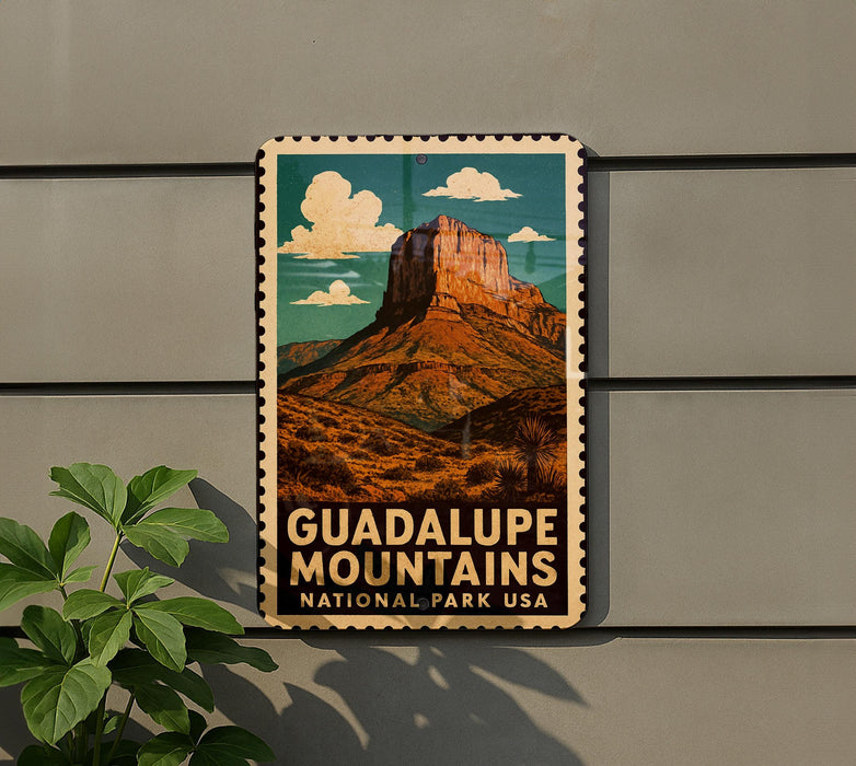 A vintage-style metal sign with a mountain landscape and the text "GUADALUPE MOUNTAINS NATIONAL PARK USA" is displayed on a wall.