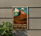 A vintage-style metal sign with a mountain landscape and the text "GUADALUPE MOUNTAINS NATIONAL PARK USA" is displayed on a wall.