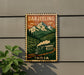 A vintage-style poster of a train traveling through a mountainous landscape, with the text "DARJEELING" prominently displayed.
