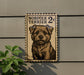 a dog, specifically a Terrier breed, with a postage stamp-like design on a wall.