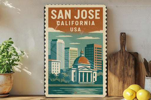 A vintage-style metal sign with a colorful illustration of San Jose, California, USA, featuring a domed building, palm trees, and a body of water.