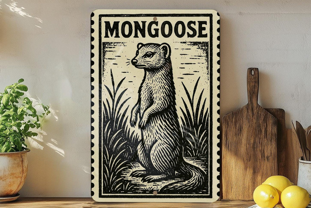 a framed illustration of a mongoose, a type of small, agile rodent, standing in a grassy area. The mongoose is depicted in a black and white illustration style, with a wooden frame surrounding the artwork. The artwork is displayed on a shelf, with a potted plant and a wooden cutting board visible in the background.