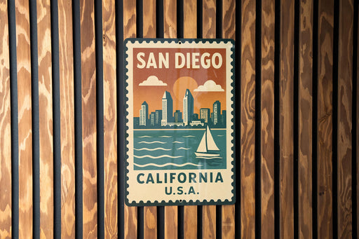 A vintage-style metal sign with the text "SAN DIEGO, CALIFORNIA U.S.A." displayed on a wooden wall.