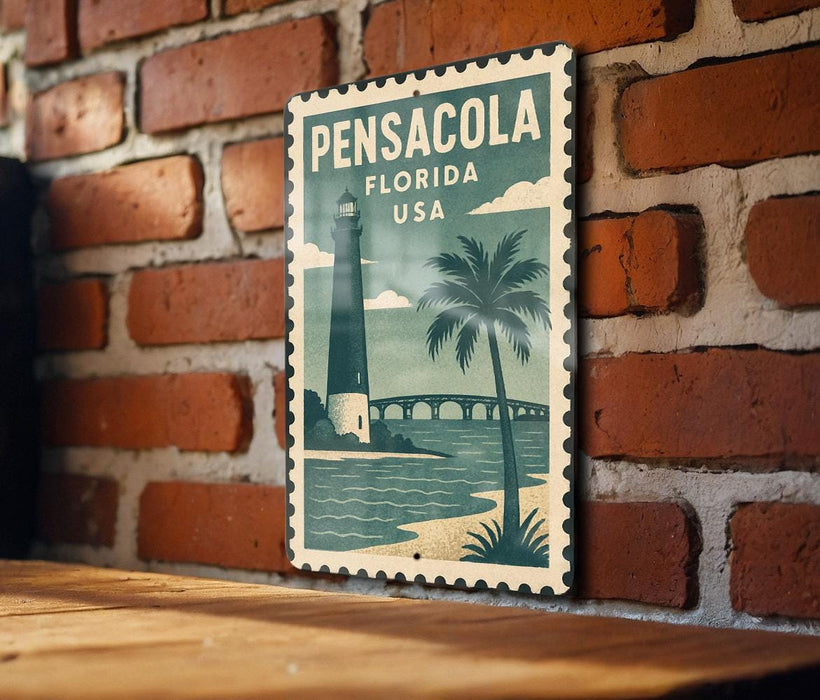 A vintage-style metal sign with a lighthouse and palm trees, mounted on a brick wall.
