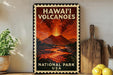 A vintage-style poster of the Hawaiian Volcanoes National Park, featuring a fiery volcanic eruption and the text "HAWAII' VOLCANOES NATIONAL PARK USA".