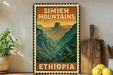 A vintage-style metal sign with the text "SIMIEN MOUNTAINS" and "ETHIOPIA" printed on it, displayed on a shelf next to a wooden cutting board and a potted plant.