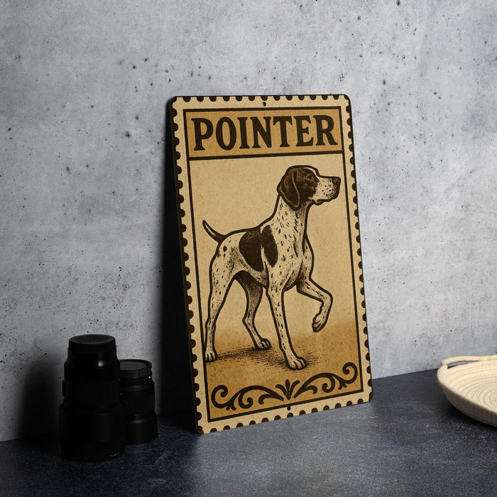 a wooden sign with a dog illustration, placed on a table next to some black camera lenses.