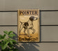 a sign with a dog illustration, mounted on a wall next to a plant.