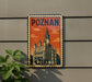 A vintage-style metal sign with the word "POZNAN" and an illustration of a castle or palace, mounted on a wall.