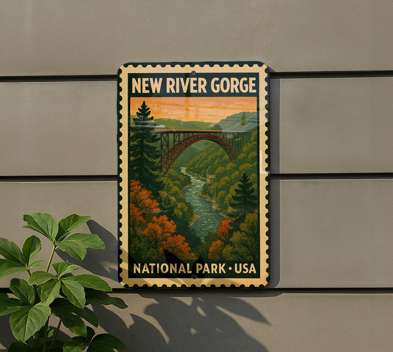 A vintage-style metal sign for New River Gorge National Park, USA, featuring a scenic illustration of a bridge over a river surrounded by autumn foliage.