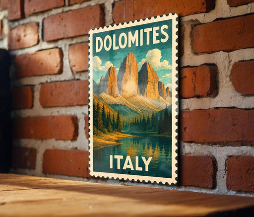 A vintage-style poster of Dolomites, a famous mountain range in Italy, is displayed on a brick wall.